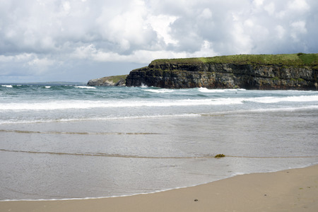 big waves rolling into the cliffs and beach in ballybunion on the wild atlantic wayの写真素材