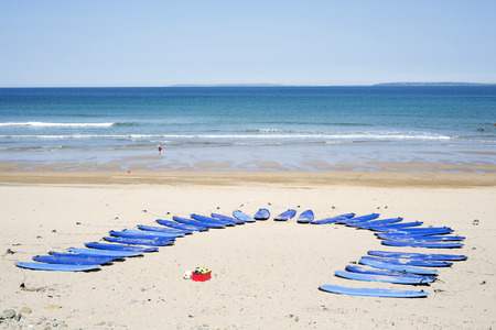 surf boards at surf school on ballybunion beach in county kerry irelandの写真素材