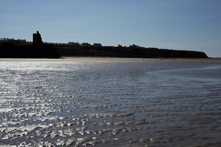 view of castle and rippled beach on the wild atlantic wayの写真素材