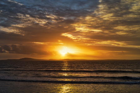 beal beach near ballybunion on the wild atlantic way ireland with an orange sunsetの写真素材
