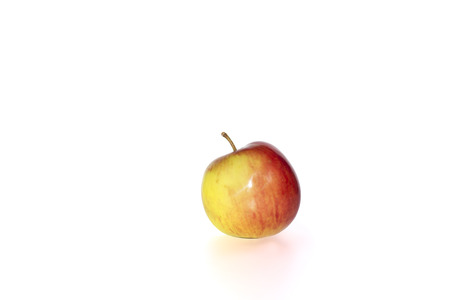 small juicy red and yellow apple against a white background with clipping pathの写真素材