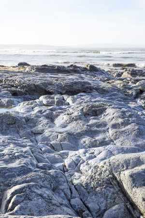 beautiful soft waves break on the rocks at ballybunion beach in irelandの写真素材