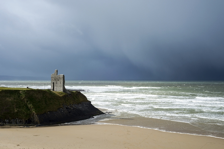 winter rain storm approaching ballybunion beach and castleの写真素材