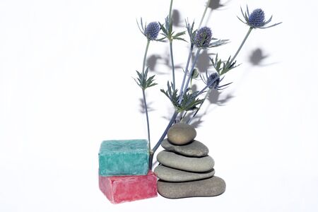 soaps off various shades with grey sone pebbles and lavenderの写真素材