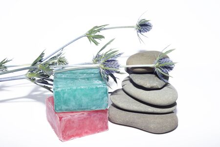 soaps off various shades with grey sone pebbles and lavenderの写真素材