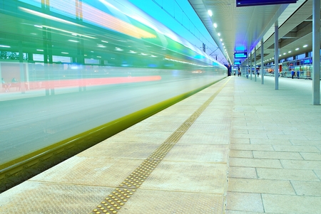 deserted platform of a modern railway stationの写真素材