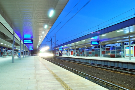 deserted platform of a modern railway stationの写真素材