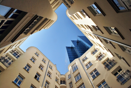 Warsaw, Poland. 20 April 2017 Tenement house on the background of a modern office building Moniuszko...