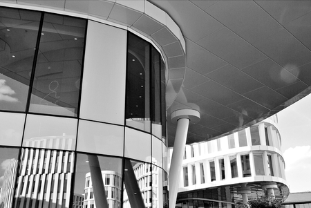 Modern office building with facade of glass. Black and white