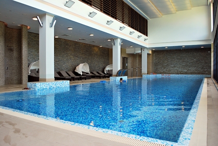 Warsaw, Poland. 10 June 2017. DoubleTree by Hilton Hotel & Conference Center Warsaw. Indoors swimming pool in luxury hotel.のeditorial素材