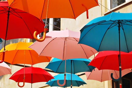 Colorful umbrellas background. Colorful umbrellas in the sky. Street decoration.
