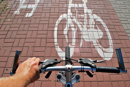 Man's hand on a bike handle bar: ready to startの写真素材