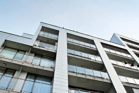 Modern apartment buildings on a sunny day with a blue sky. Facade of a modern apartment building