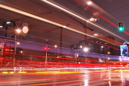 Warsaw, Poland. 22 September 2017. Straight street. City traffic at night. blurred cars driving during heavy rain and splashing water from the wheels.のeditorial素材
