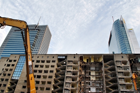 Demolition old building in downtown with heavy equipmentのeditorial素材
