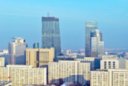 Background of cityscape concept: Abstract blurred aerial view of city on twilight sky and clouds.の写真素材