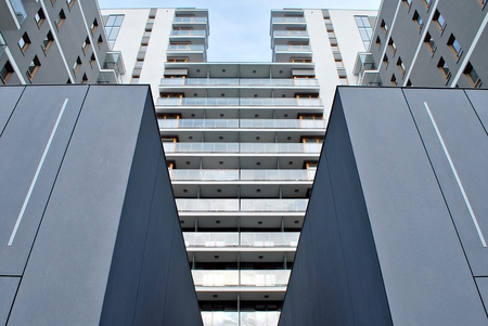 Modern apartment buildings on a sunny day with a blue sky. Facade of a modern apartment building
