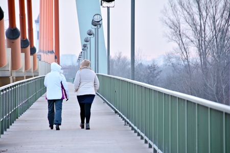 Two women on the bridgeの写真素材