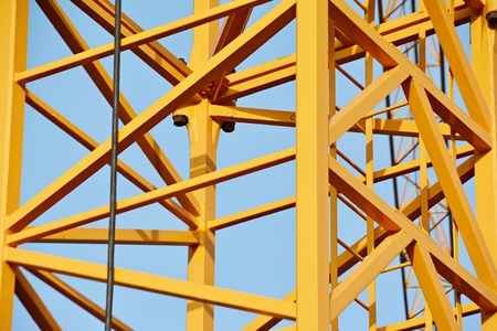 Construction of high-rise office center with modern technology. Fragment of a building on a light...