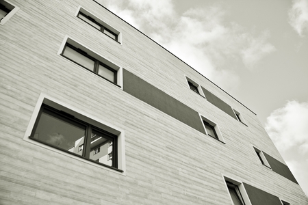 Facade of a modern apartment building. Black and white