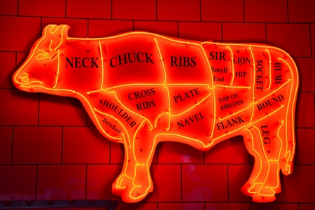 Neon in the butcher shop. Beef meat diagramの写真素材