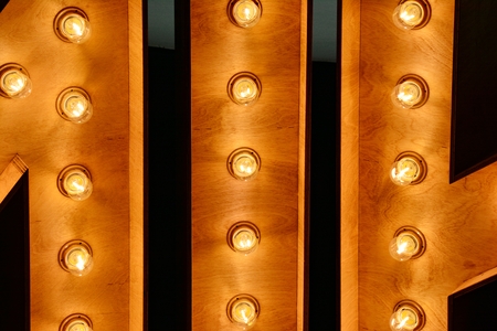 Light bulb over the wooden background. Background wood planks with lampsの写真素材