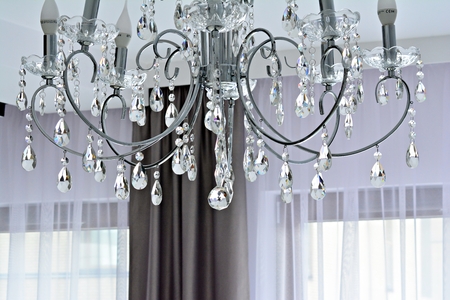 Contemporary crystal chandelier in room interior. Close upの写真素材