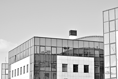 Glass walls of a office building - business background. Black and white.の写真素材