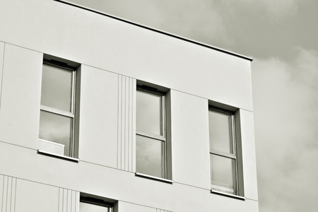 Detail of a new modern apartment building. Black and white.