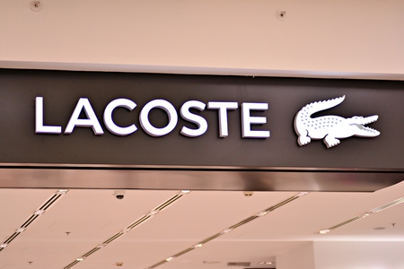 Warsaw, Poland. 17 March 2018. Sign Lacoste. Lacoste company signboard.のeditorial素材