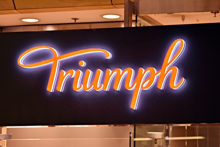 Warsaw, Poland. 17 March 2018. Sign Triumph. Company signboard Triumph.のeditorial素材