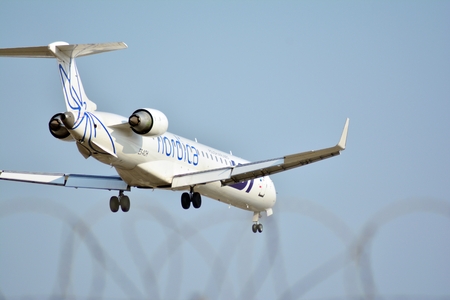 Warsaw, Poland. 25 March 2018. Passenger airplane LOT Polish Airlines just before landing at the...