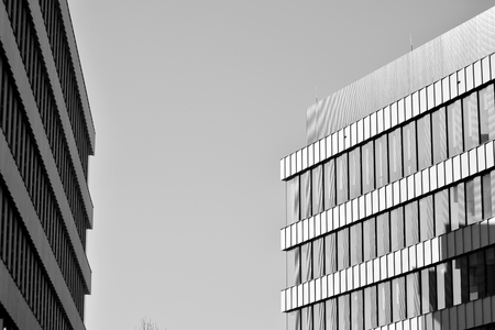 Modern office building wall made of steel and glass. Black and white.の写真素材