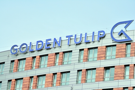Warsaw, Poland. 3 April 2018. Sign Golden Tulip. Company signboard Golden Tulip.のeditorial素材