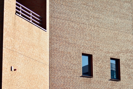 Beautiful facade of a modern office building made of red brick.
