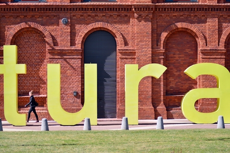 Lodz, Poland. 7 April 2018. Shopping Mall Manofaktura in Lodz transformed from industrial buildings into an elegant place for shopping.のeditorial素材
