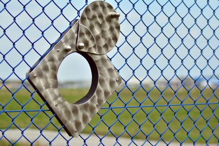 Lens hole. observation hole in the fenceの写真素材