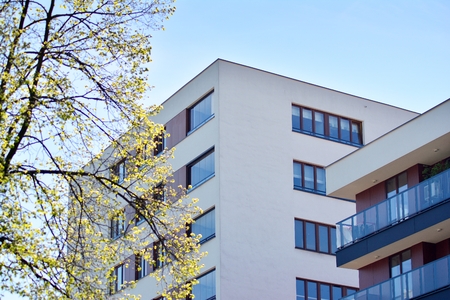 Modern apartment buildings on a sunny day with a blue sky. Facade of a modern apartment building
