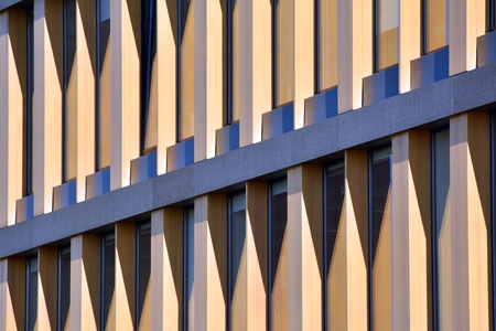 Urban abstract background, detail of modern glass facade, office business building.
