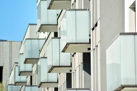 Modern apartment buildings on a sunny day with a blue sky. Facade of a modern apartment building
