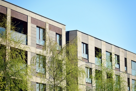 Modern apartment buildings on a sunny day with a blue sky. Facade of a modern apartment buildingの写真素材