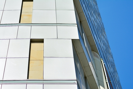Urban abstract background, detail of modern glass facade, office business building