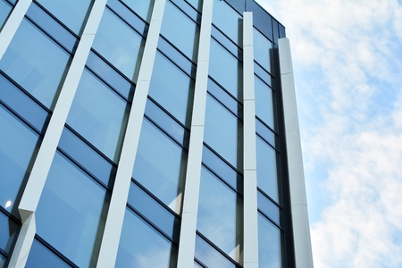 Urban abstract background, detail of modern glass facade, office business building