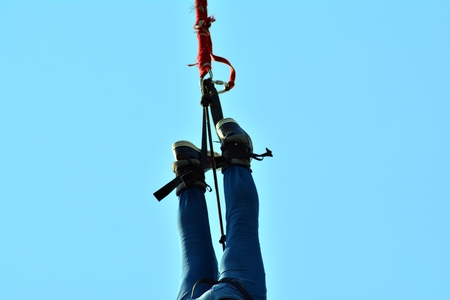 Warsaw, Poland. 28 April 2018. An extreme sportsman jumps on a rope from a great height....