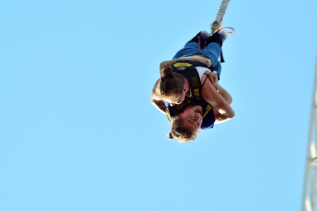 Warsaw, Poland. 28 April 2018. Tandem bungee jump in Warsaw. Bungee jump for two. Young couple...