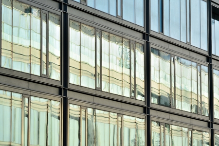 Urban abstract background, detail of modern glass facade, office business building
