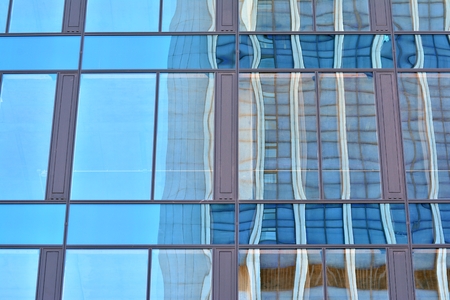 Urban abstract background, detail of modern glass facade, office business buildingの写真素材