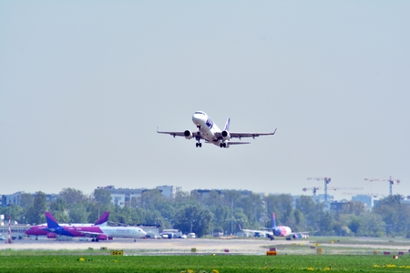Warsaw, Poland. 4 May 2018. Passenger airplane Embraer 175 PLL LOT Airlines is flying from the Warsaw Chopin Airport runwayのeditorial素材