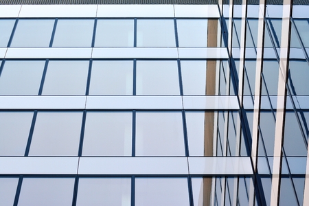 Urban abstract background, detail of modern glass facade, office business building