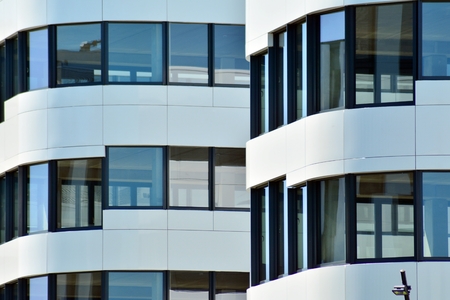 Modern office building wall made of steel and glassの写真素材